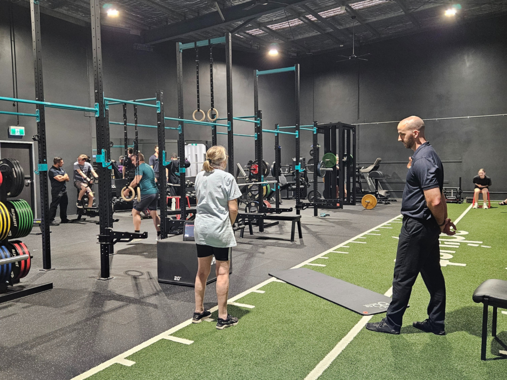 Image of patient performing exercises in the gym with a physiotherapist